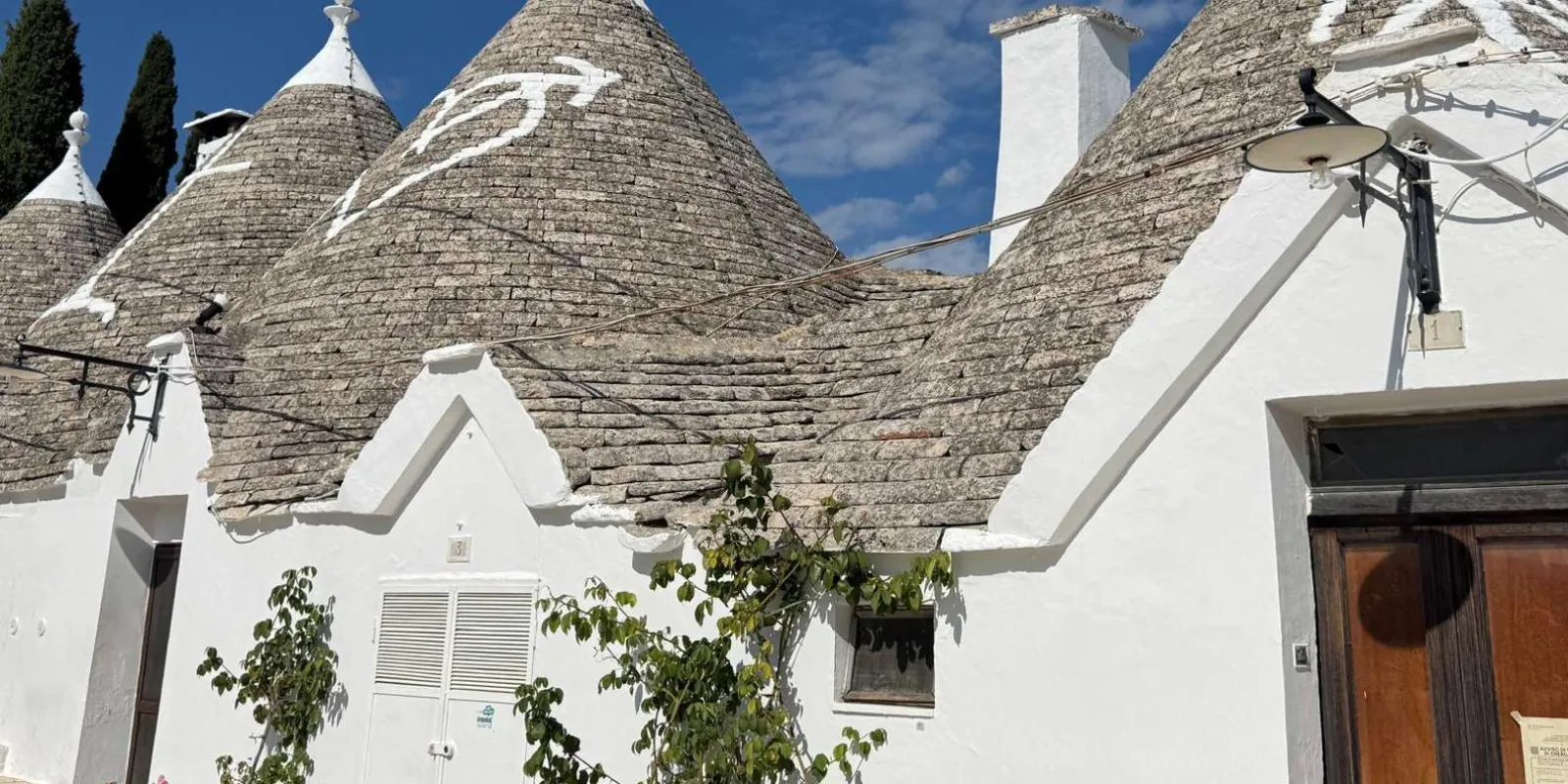 Roof symbols on whitewashed trulli