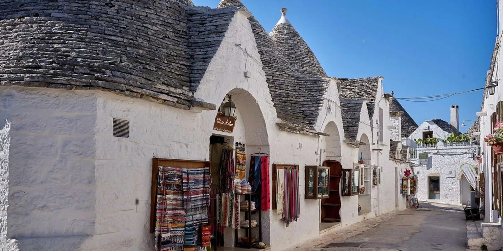 Arched entrance in a white trullo building