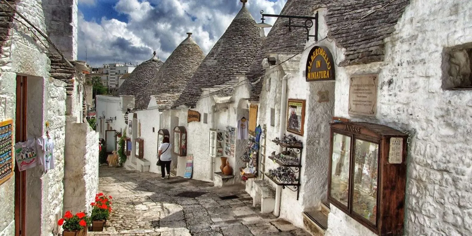 Stone-paved lane between trulli